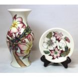 Modern Moorcroft Pottery "Frangipani Plumeria" pattern vase of baluster form with white ground,