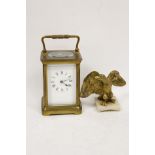 Carriage timepiece in corniche case and a gilt eagle finial.