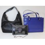 Three L K Bennett lady's handbags: a black leather slouch shoulder bag, approx. 39cm wide; a blue
