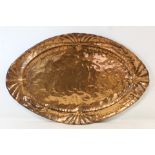 Arts and Crafts hand beaten copper tray of elliptical form with repousse salamander, tadpole and