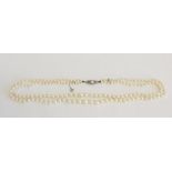 Twin strand cultured pearl necklace, graduated form 3.5-8.5mm with a white metal clasp