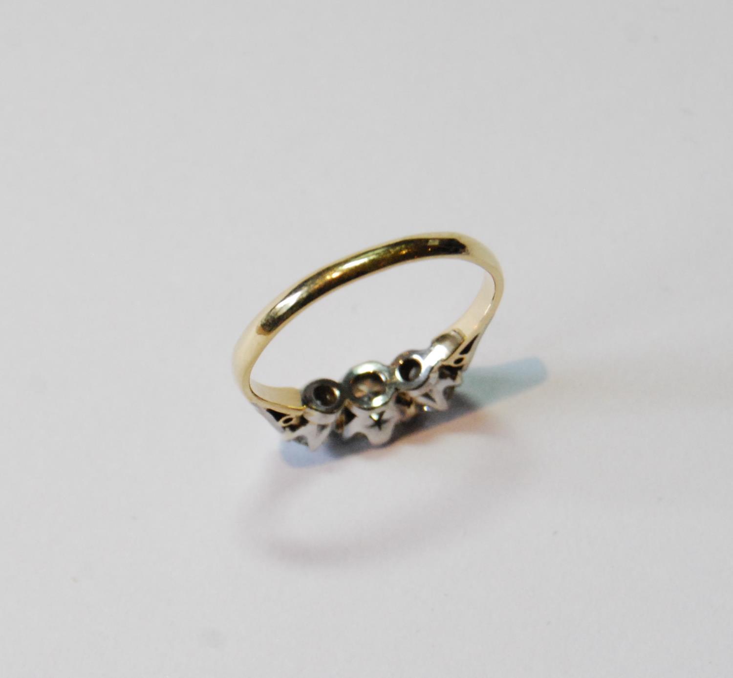 Diamond three-stone ring, the largest brilliant approximately .6ct, in gold, '18ct', size R. - Image 3 of 3