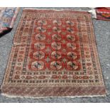 Tekke rug, the three rows of six guls over faded red ground and multiple border, 151cm x 120cm.