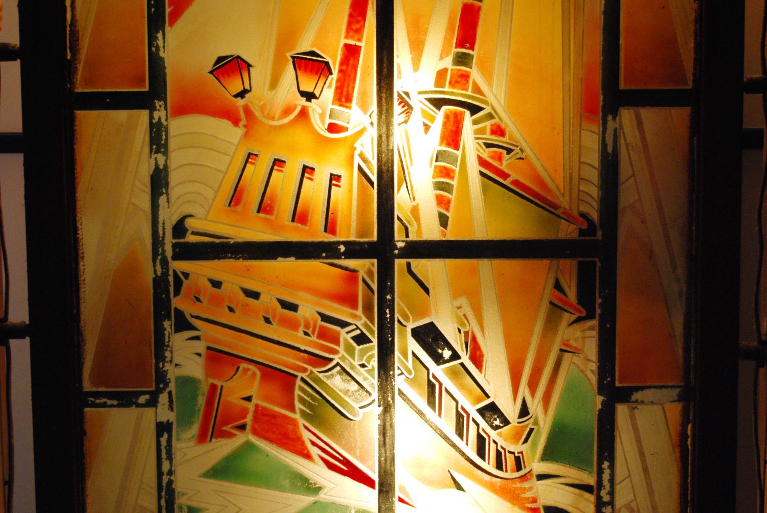 Large Art Deco painted glass cinema panel depicting a sailing ship, decorated in greens and oranges, - Image 7 of 10