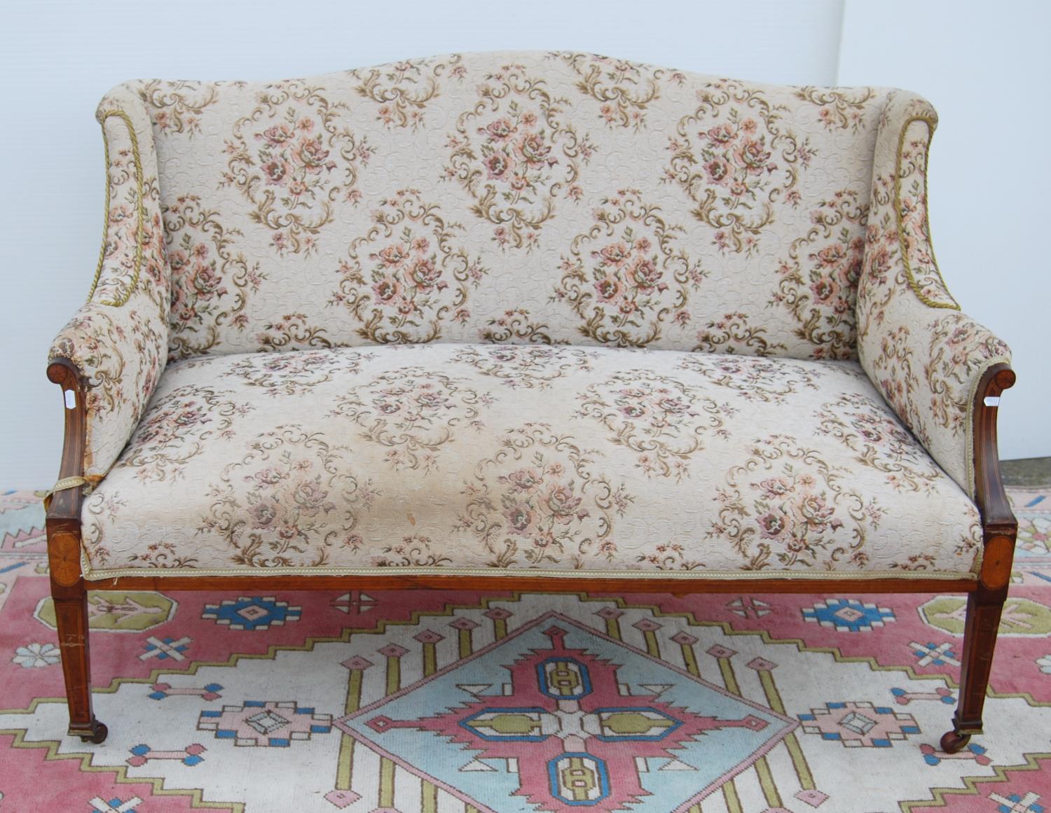 Edwardian mahogany and inlaid parlour sofa with serpentine cushioned back, down swept arms, on