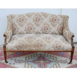Edwardian mahogany and inlaid parlour sofa with serpentine cushioned back, down swept arms, on
