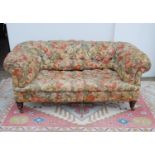 Victorian chesterfield sofa with buttoned back and seat, on tapering ring turned legs and ceramic