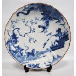 Japanese blue and white Kakiemon-style dish with lobed lotus rim enamelled in brown, the central