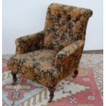 Victorian button-back armchair with cushioned arms, sprung seat, on tapering baluster legs