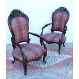 Pair of Victorian-style open armchairs with cushioned backs mounted by floral carved panels,