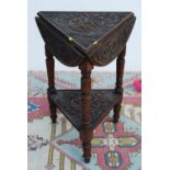 Carved oak occasional table, the triangular top with demi-lune drop flaps, on baluster turned legs