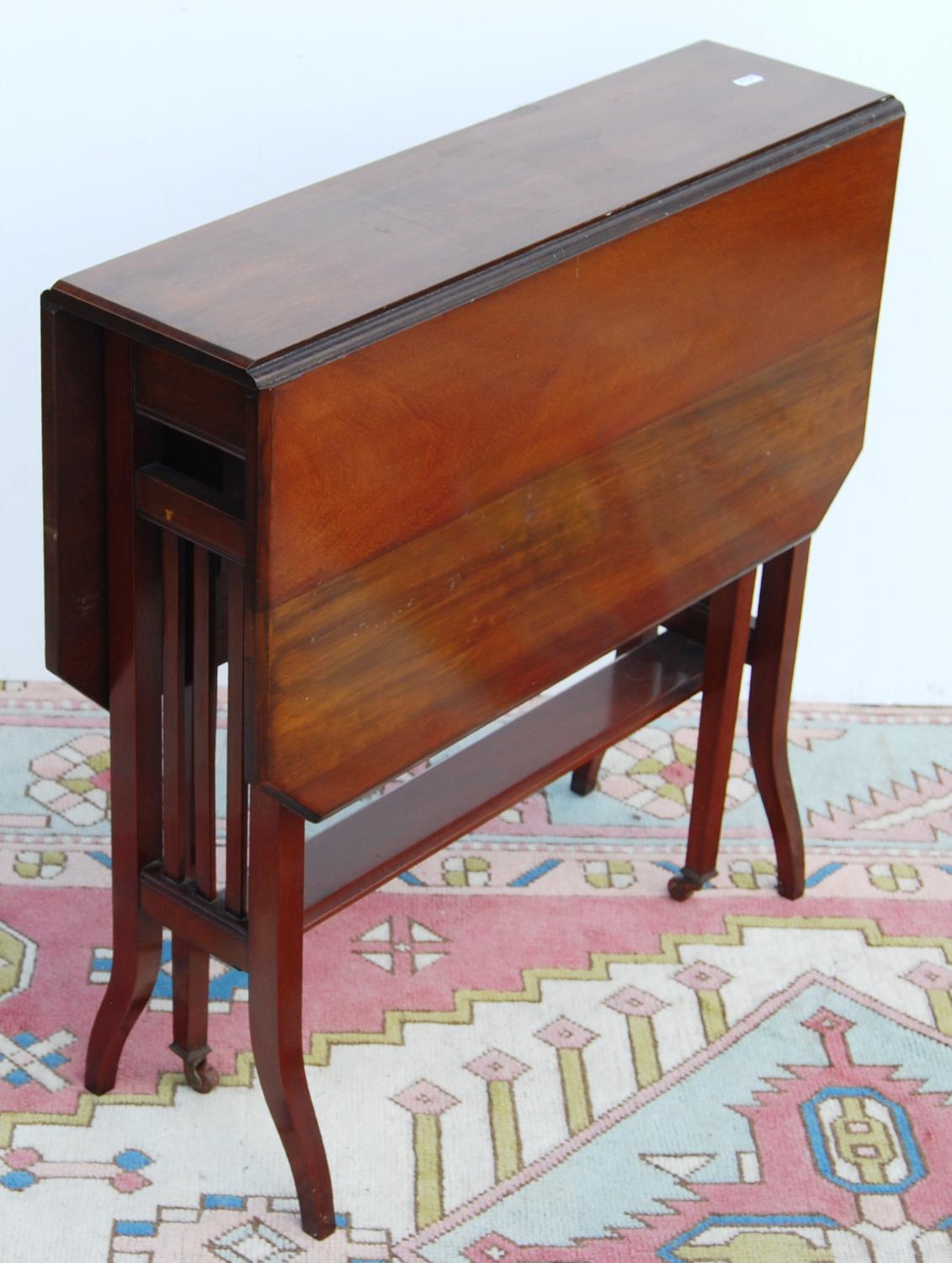 Mahogany Sutherland table, the rectangular drop flap top with canted corners, on square legs