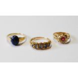 Victorian foiled beryl five-stone ring, a synthetic ruby cluster ring, 18ct, 1911, and another