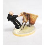 Late 19th century Royal Crown Derby flower vase modelled as a monk pulling against a mule, 28cm wide