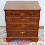 George III style mahogany bachelor's chest, the moulded rectangular top over brushing slide and four