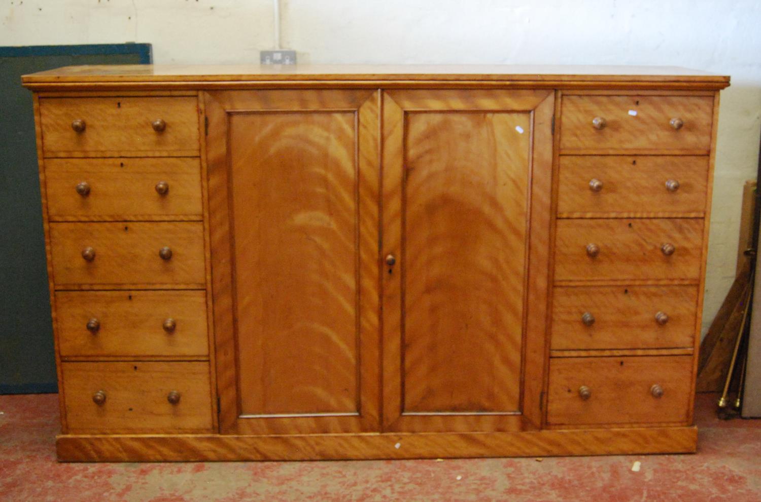 Mahogany gentleman's compactum in the manner of Gillows, the rounded rectangular top over two