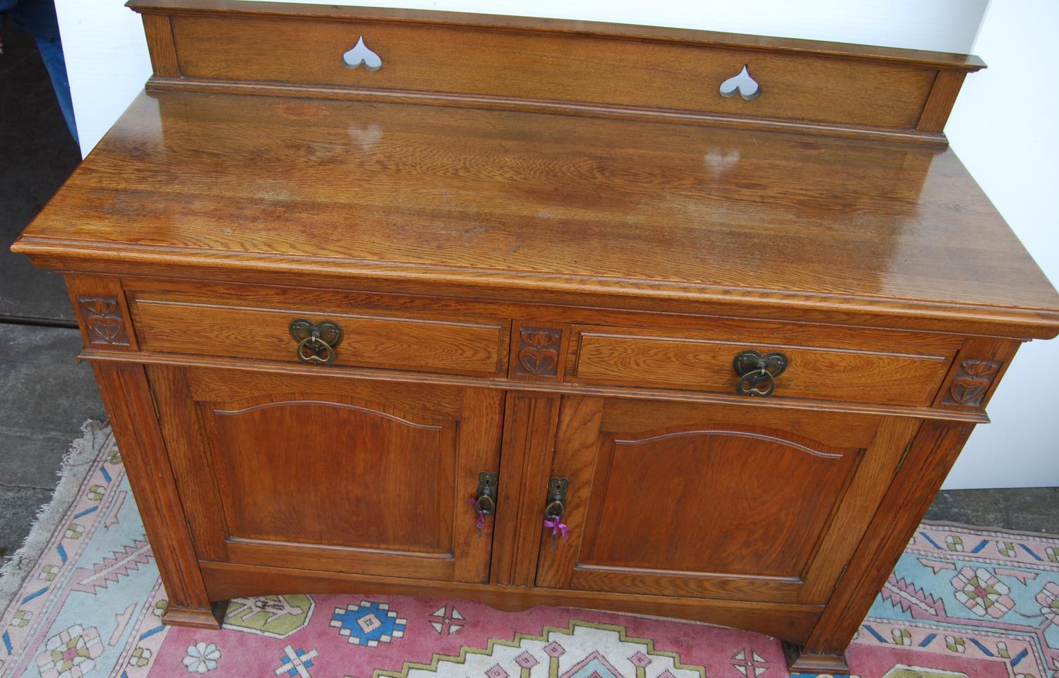 Aesthetic oak sideboard, the back panel with pierced inverted hearts, moulded rectangular top over - Image 5 of 7