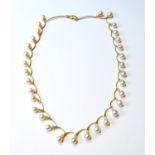 Gold and cultured pearl necklace with twelve small diamonds, collet-set, '750', 25g gross.