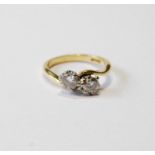 Diamond crossover ring with two brilliants, each approximately .3ct, in gold, '18ct', size G.