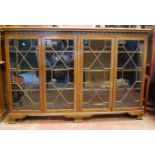 George III style mahogany bookcase, the moulded rectangular top over closed fretwork frieze, four