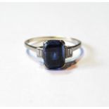 Ring with rectangular sapphire flanked by two baguette diamonds, in platinum, size O½.