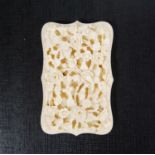 19th century Canton floral carved ivory card case of serpentine rectangular form, 7cm wide and
