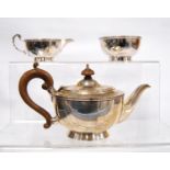 George V silver bachelor's tea set consisting of teapot, sugar bowl and creamer, by William