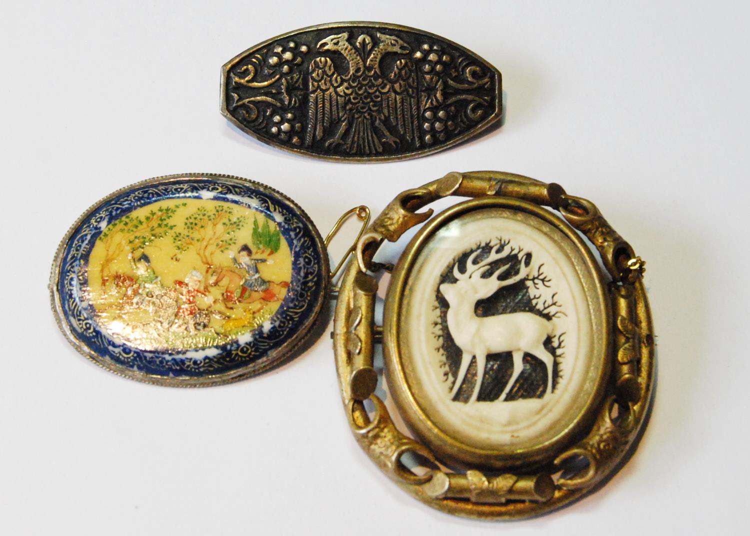Persian painted bone oval brooch with equestrian figures and two others.  (3)