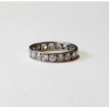 Diamond eternity ring with twenty brilliants, each approximately .1ct, in platinum.