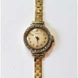 Garrard lady's 18ct gold watch with diamond-set bezel, 1919, movement replaced, on 9ct gold