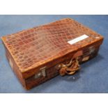 Crocodile skin travel case, 70cm long and 45cm wide.