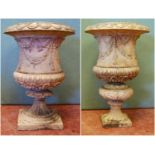 Near pair of 19th century Neoclassical garden urns with gadrooned rims, tapering trunks decorated
