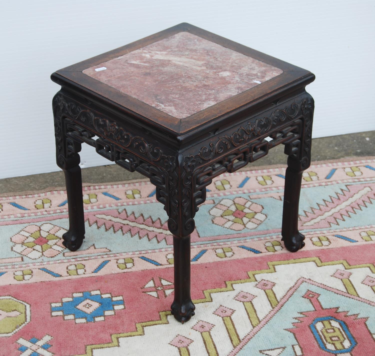 Oriental hardwood and marble jardinière stand, the moulded square top with marble inset panel over