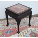 Oriental hardwood and marble jardinière stand, the moulded square top with marble inset panel over