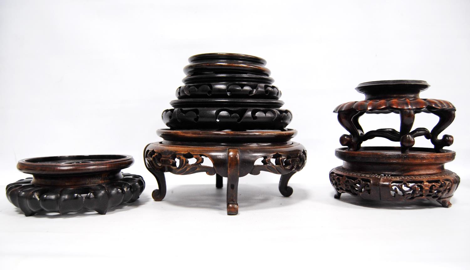 Eight oriental carved wooden stands. - Image 2 of 7