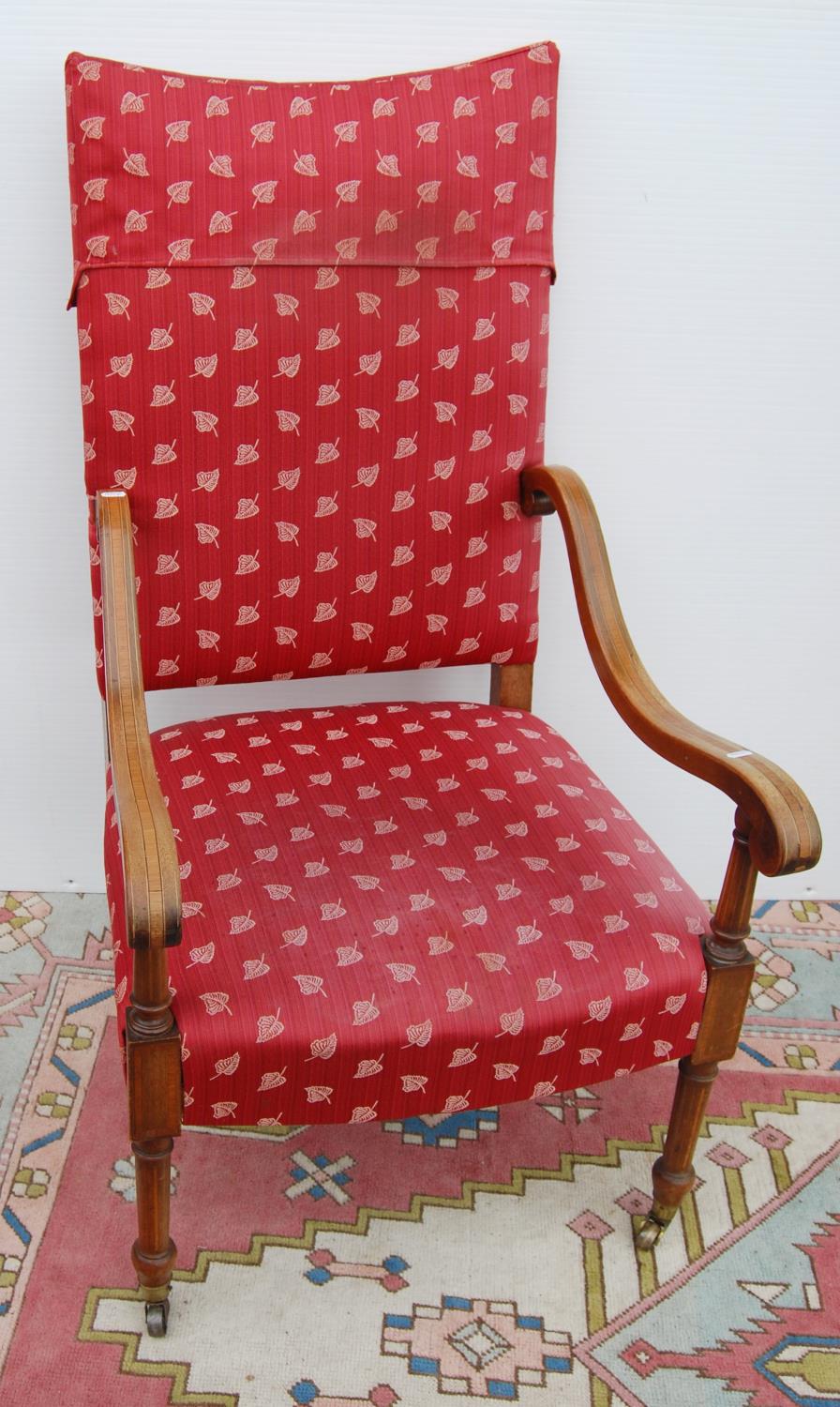 Edwardian mahogany armchair with cushioned back and seat, crossbanded serpentine arms, on boxwood