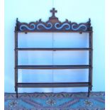 Set of Victorian mahogany wall shelves, the pierced scrolling gallery mounted by crucifix over