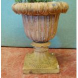 Terracotta garden urn, the fluted bowl with leaf rim, on plinth base, 46cm diameter and 55cm high.