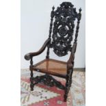 Jacobean-style oak throne chair, the elaborate carved pierced back over acanthus serpentine open