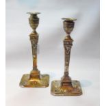 Pair of silver table candlesticks of Adams style with tapering embossed stems of square section,
