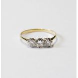 Diamond three-stone ring, the largest brilliant approximately .5ct, in gold, size P.