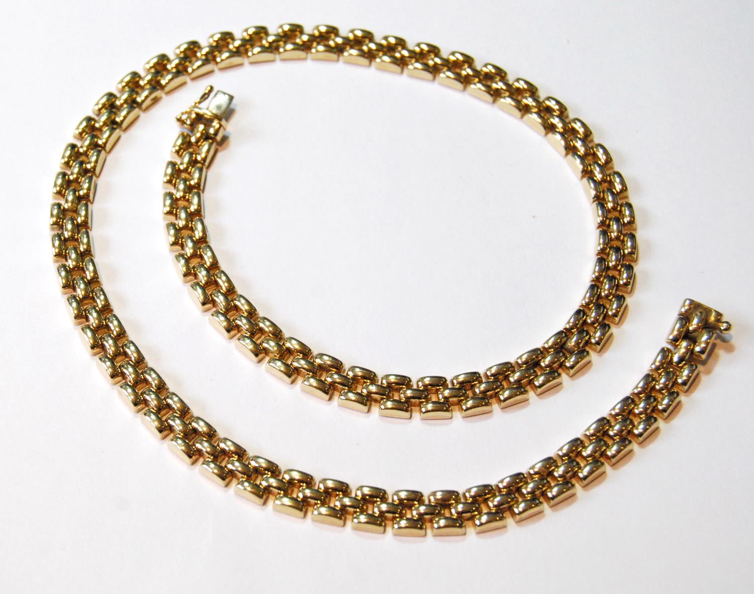 9ct gold necklace of rounded brick pattern, 32g.