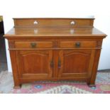 Aesthetic oak sideboard, the back panel with pierced inverted hearts, moulded rectangular top over