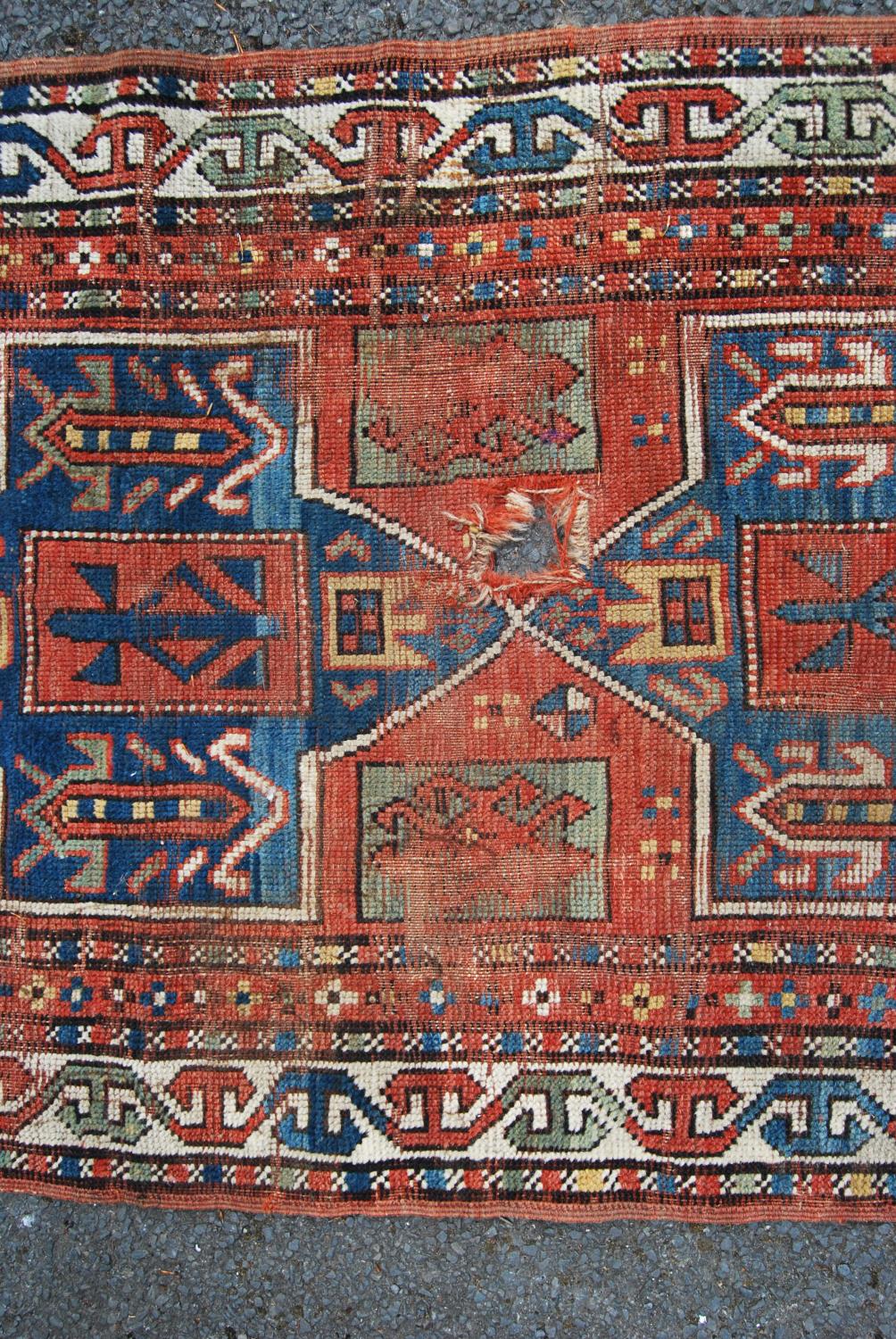 Persian rug, the three shaped blue panels over red ground, green squares and border, 190cm x 91cm. - Image 3 of 4