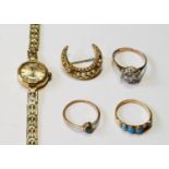 H Samuel 9ct gold bracelet watch, three rings and a crescent brooch.