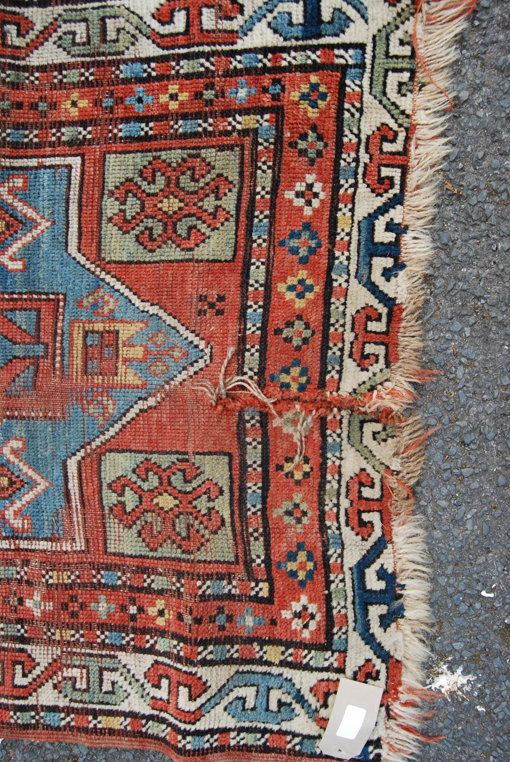 Persian rug, the three shaped blue panels over red ground, green squares and border, 190cm x 91cm. - Image 2 of 4