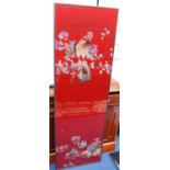 Oriental framed needlepoint depicting cockerels over red ground, 47cm wide and 146cm high.