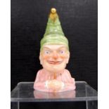 Victorian Royal Worcester novelty candle snuffer modelled as Mr Punch, designed by James Hadley,