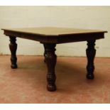 Late Victorian oak extending dining table, the moulded rectangular top with canted corners, on