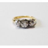Antique diamond three-stone ring with old-cut brilliants, approximately .9ct and .6ct, in silver